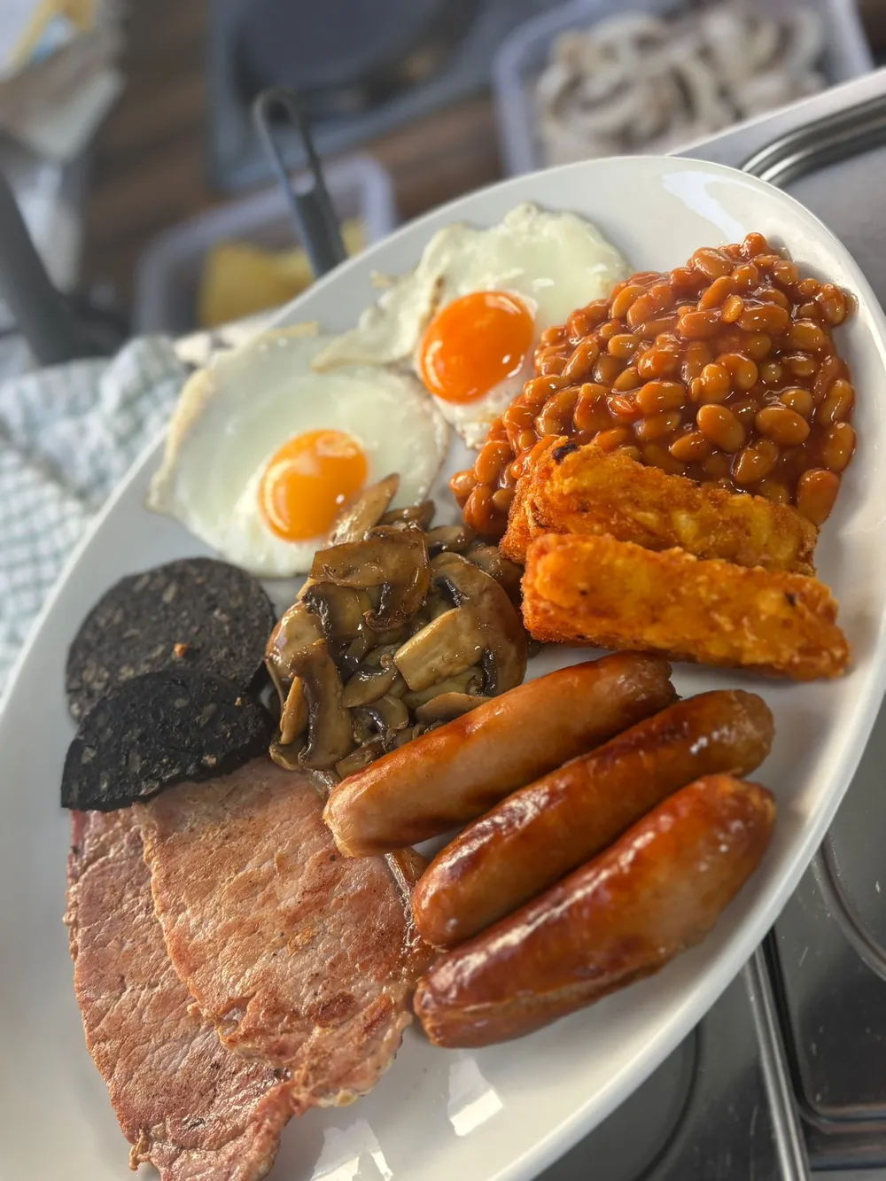 Barney's Big Breakfast, two fried eggs, local sausages, gammon, bacon, beans, hash browns, black pudding and mushrooms, griddle-cooked in Ponthir